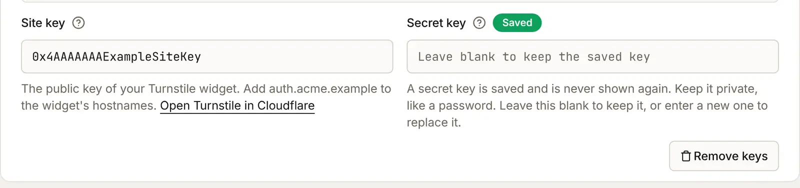 After Save: the Site key box keeps the site key, the Secret key box is empty with a Saved badge and the words "Leave blank to keep the saved key", and a Remove keys button below