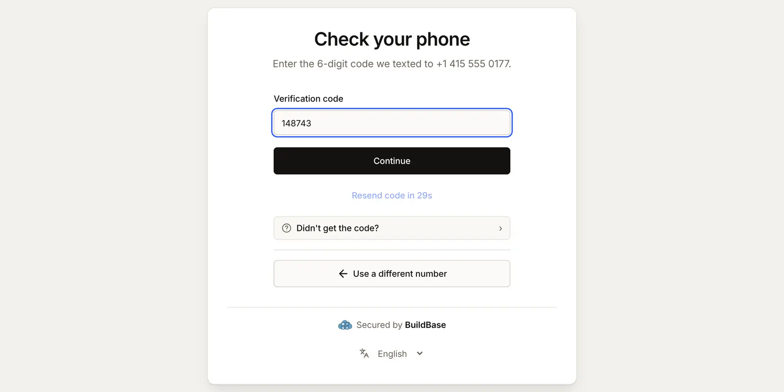 Check your phone: Enter the 6-digit code we texted to +1 415 555 0177, with the code from the text message typed in, a Continue button and Use a different number